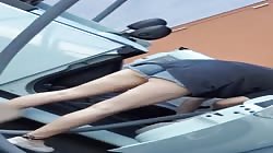 Sexy babe cleaning car
